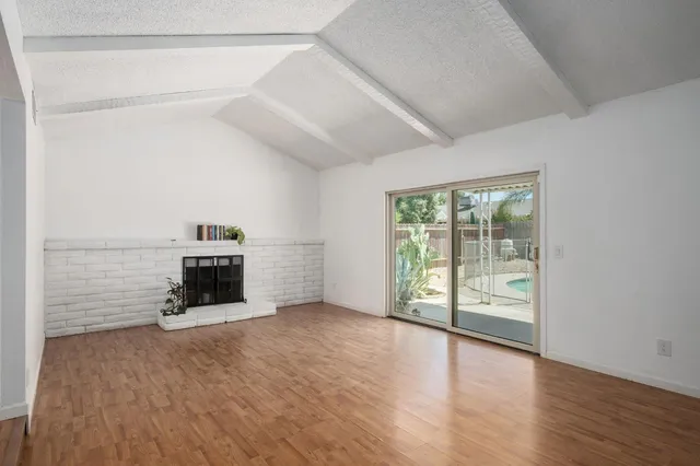 a view of a livingroom with wooden floor