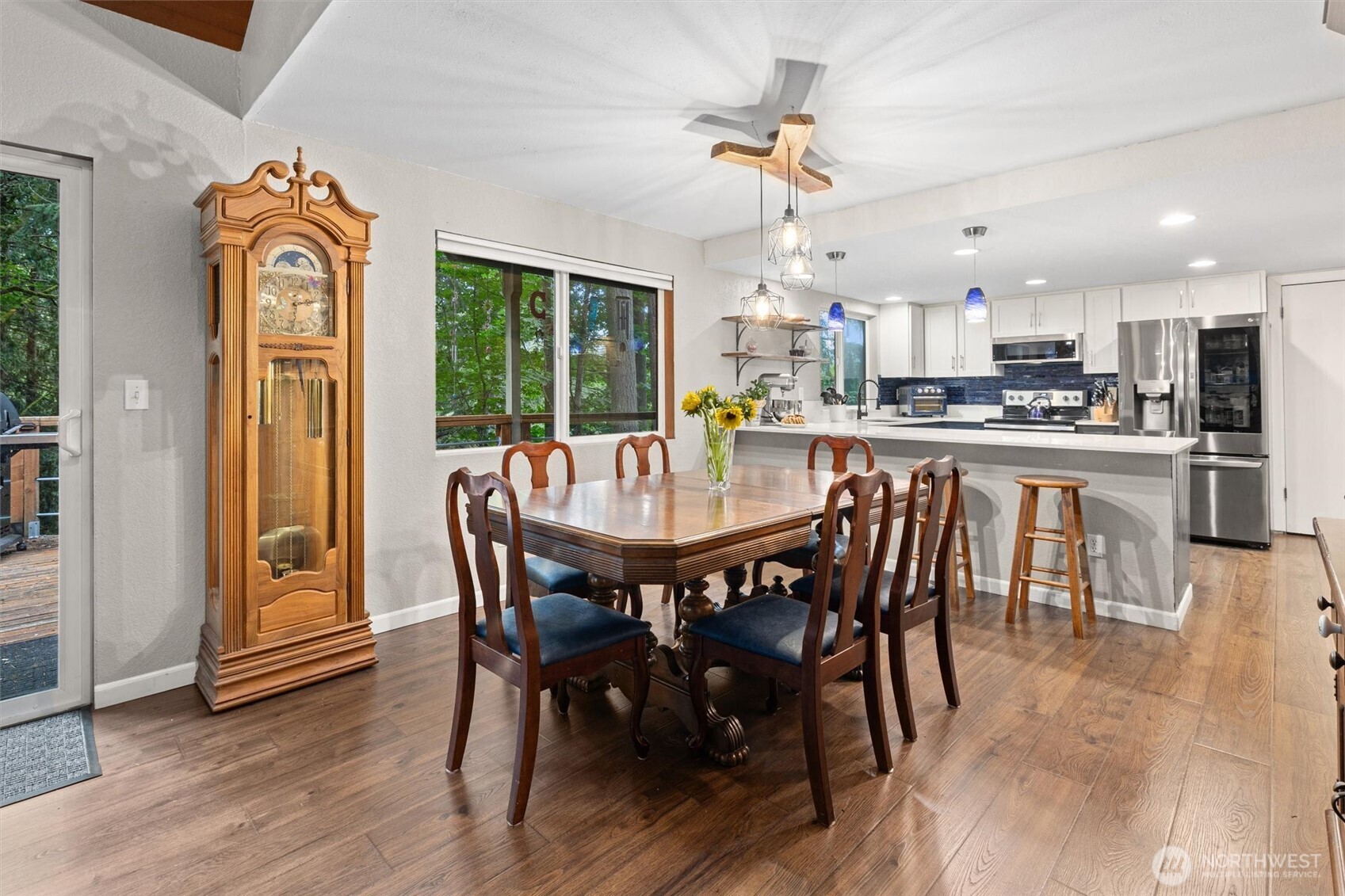 19833 95th Avenue Northeast Bothell, WA 98011 - Photo 11 of 39 a view of a dining room with furniture window and wooden floor