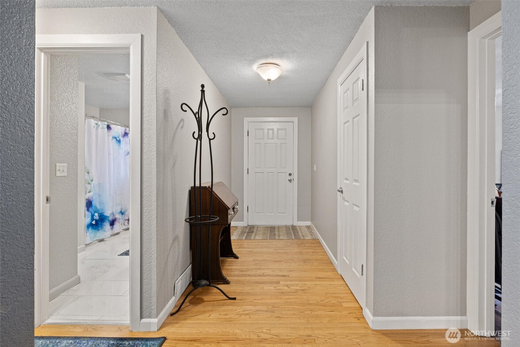 19833 95th Avenue Northeast Bothell, WA 98011 - Photo 17 of 39 a view of a hallway with wooden floor and staircase