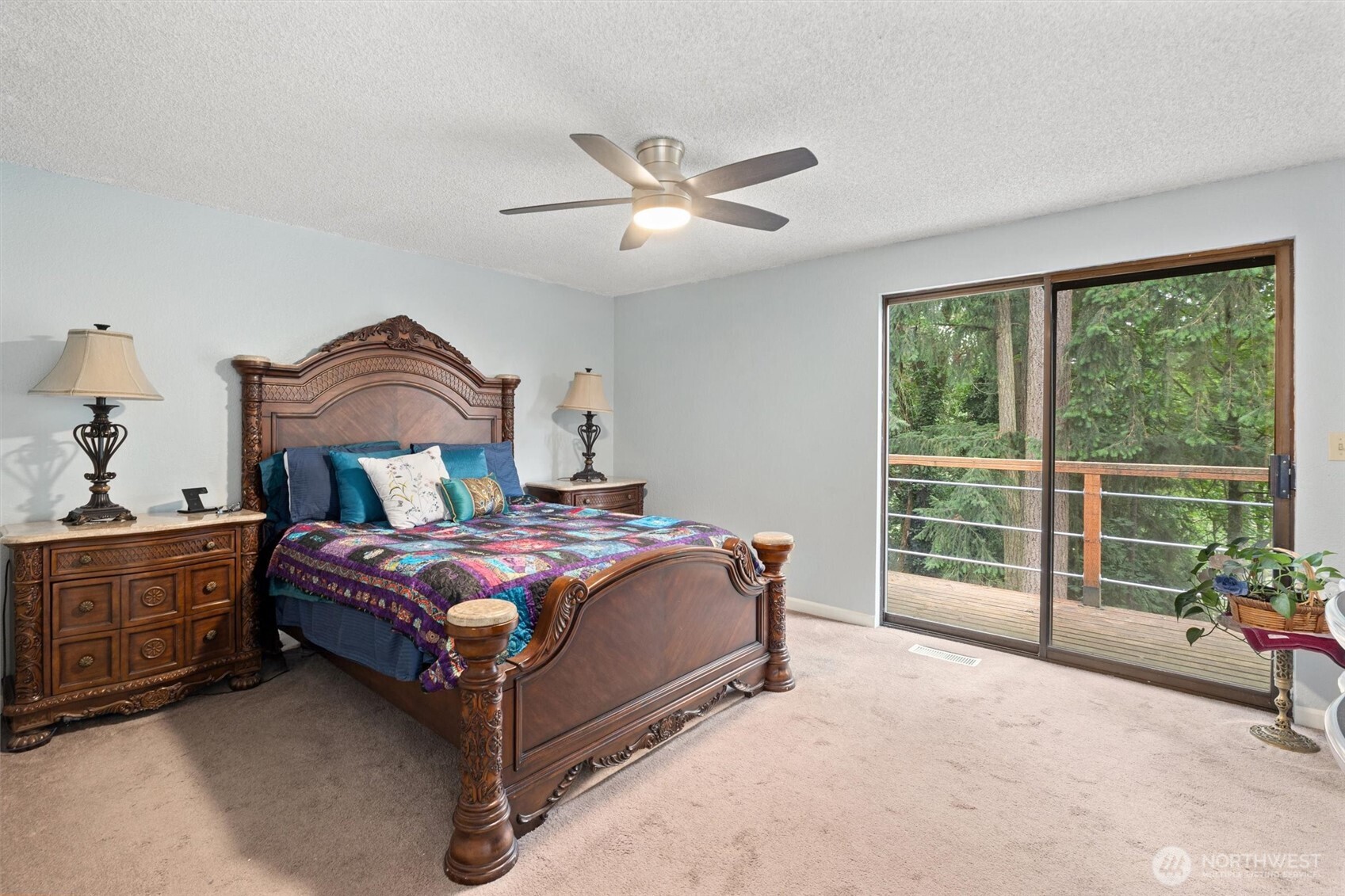 19833 95th Avenue Northeast Bothell, WA 98011 - Photo 19 of 39 a bedroom with a bed and a chandelier