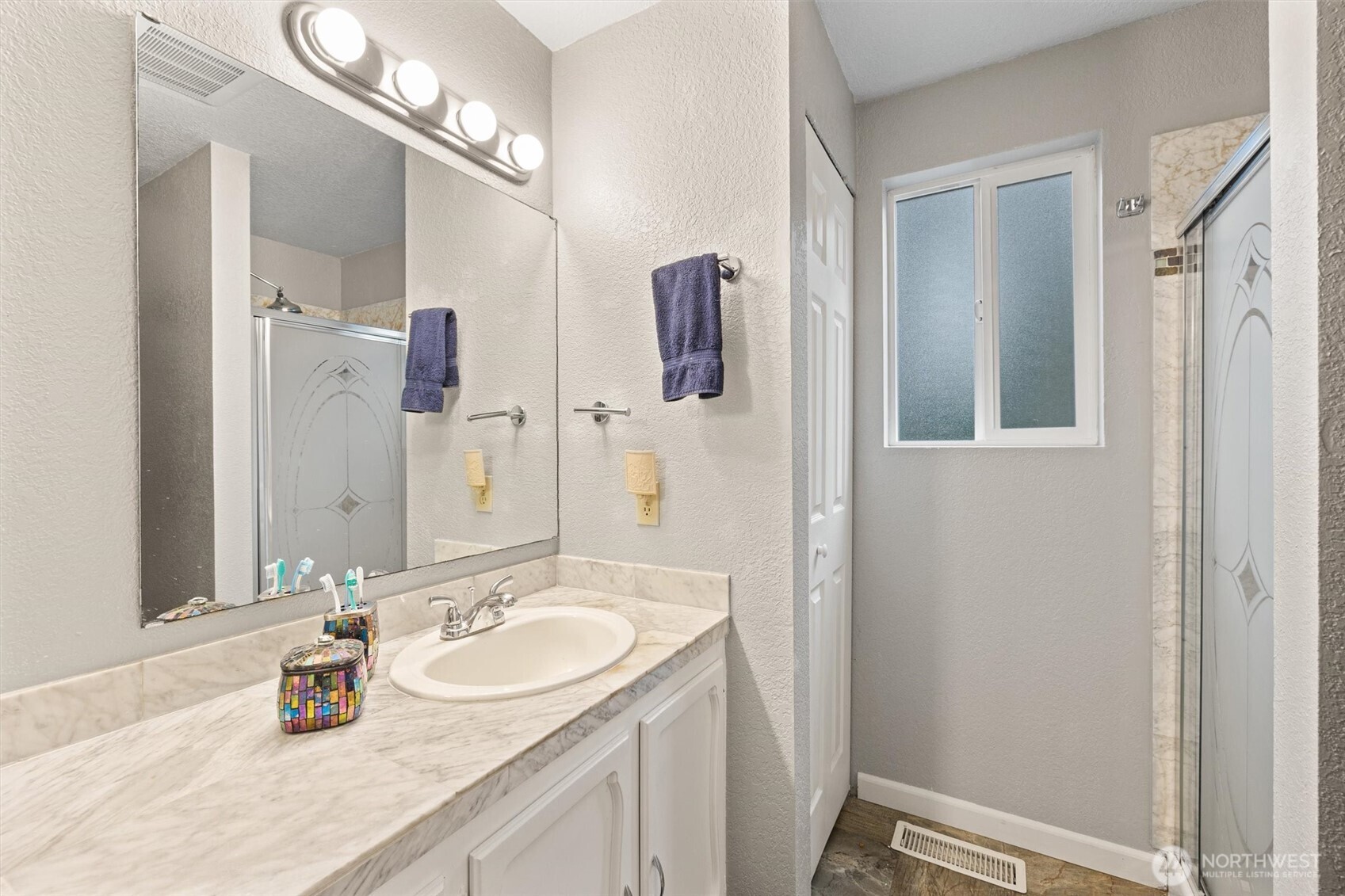 19833 95th Avenue Northeast Bothell, WA 98011 - Photo 20 of 39 a bathroom with a sink double vanity and a mirror