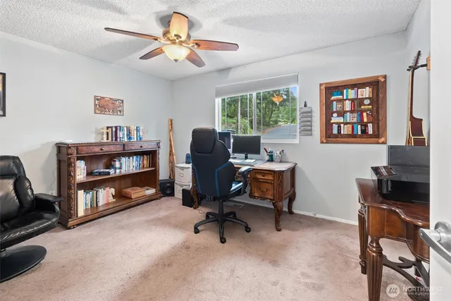 a bedroom with a bed dresser and a window