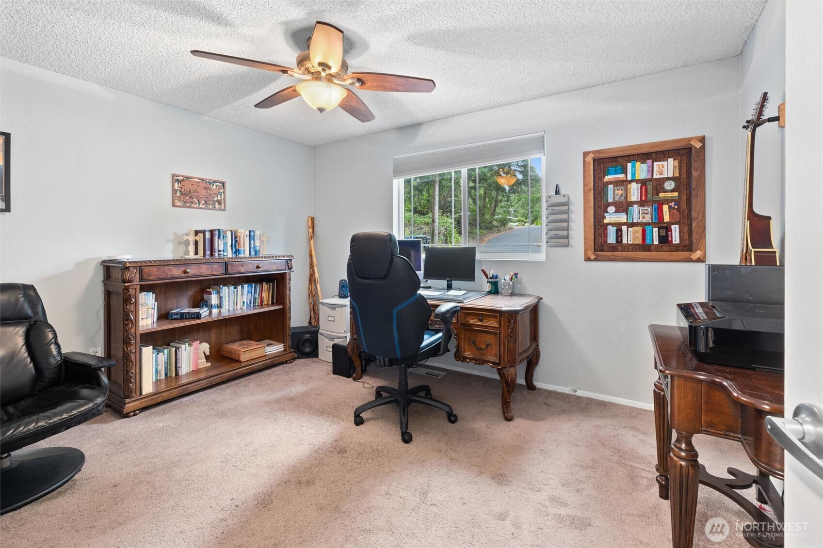 19833 95th Avenue Northeast Bothell, WA 98011 - Photo 23 of 39 a view of a workspace with furniture and a window