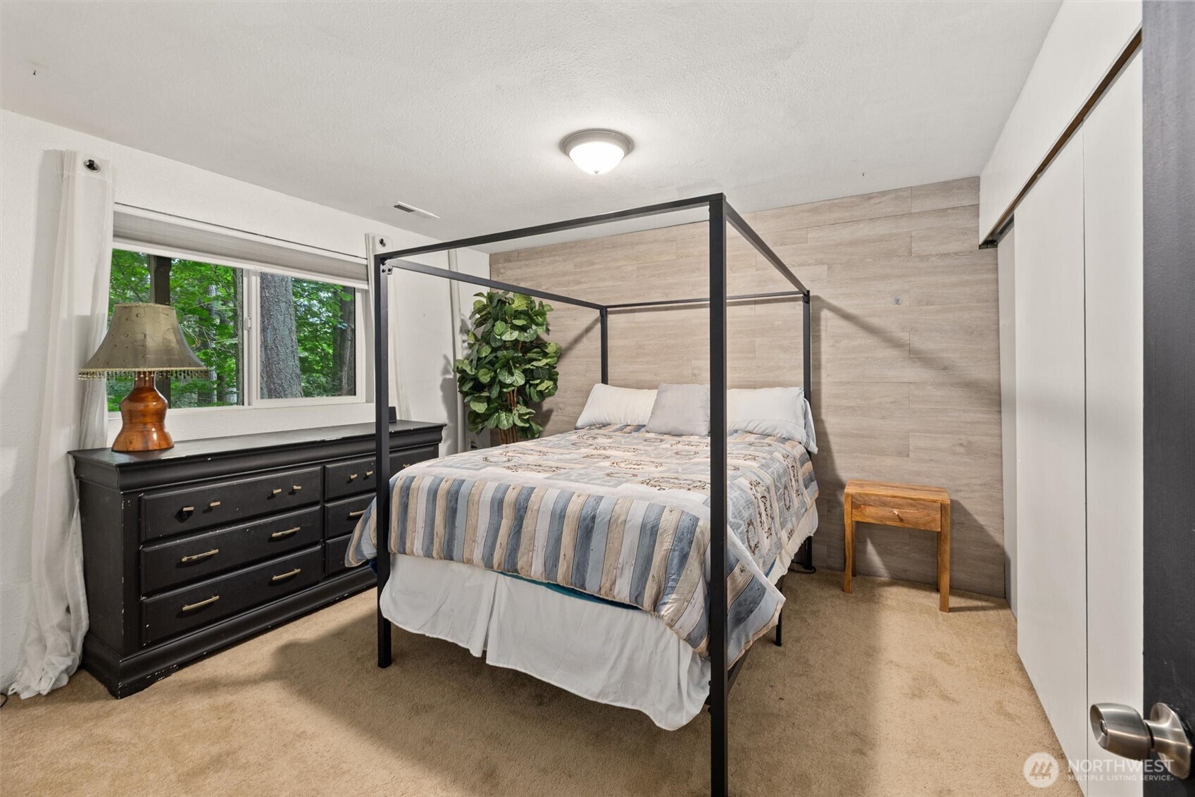 19833 95th Avenue Northeast Bothell, WA 98011 - Photo 25 of 39 a bed room with a bed and a dresser