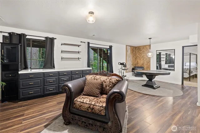 a room with lots of furniture and a chandelier