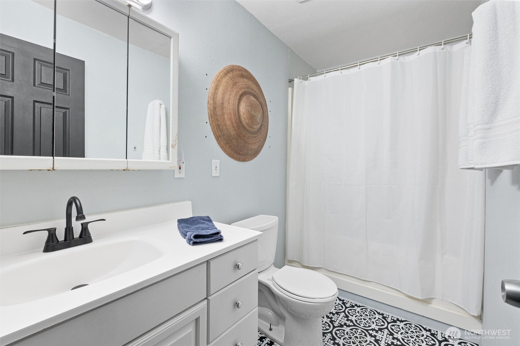 19833 95th Avenue Northeast Bothell, WA 98011 - Photo 32 of 39 a bathroom with a sink a toilet and a mirror