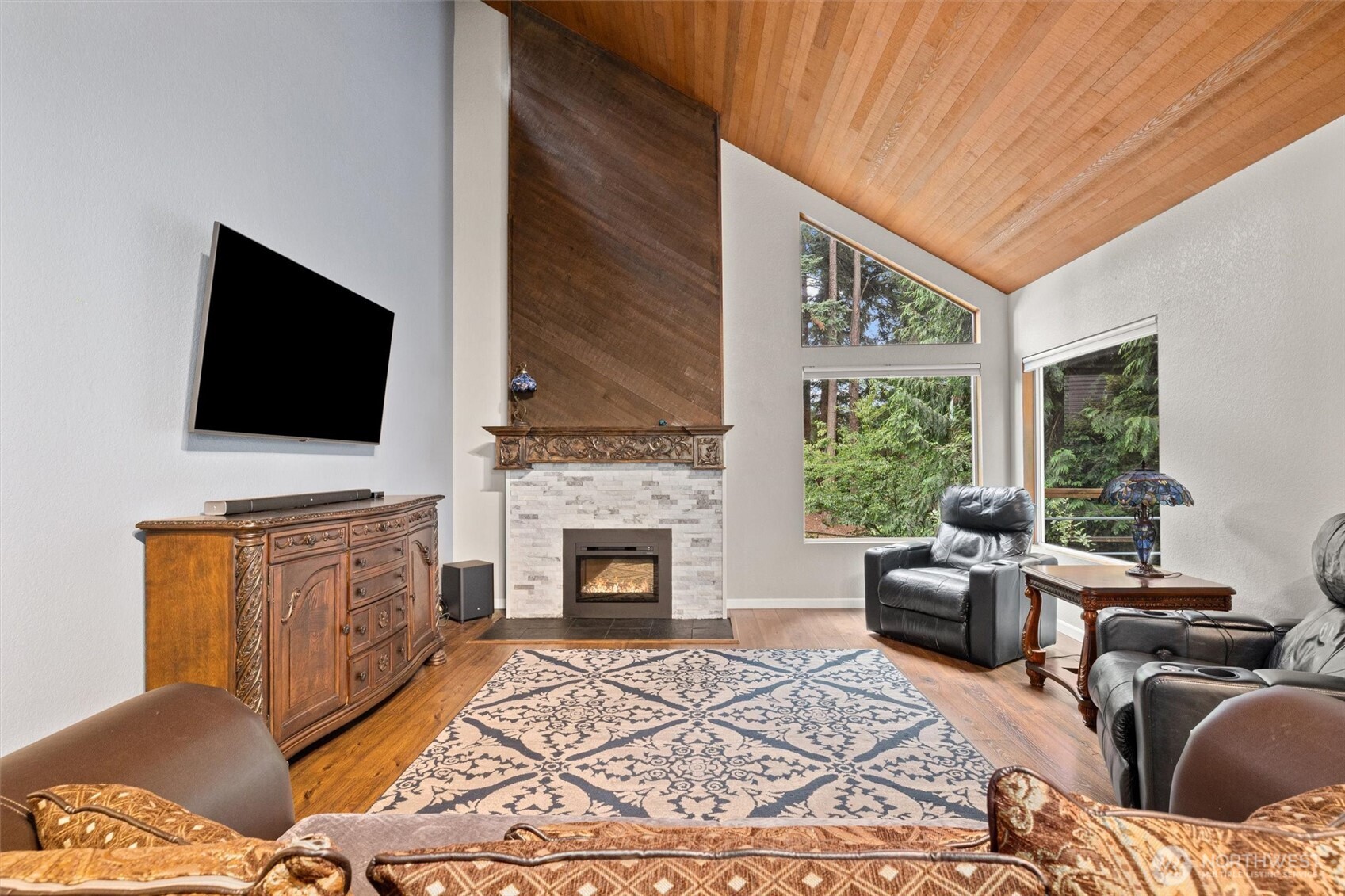 19833 95th Avenue Northeast Bothell, WA 98011 - Photo 7 of 39 a living room with furniture and a flat screen tv