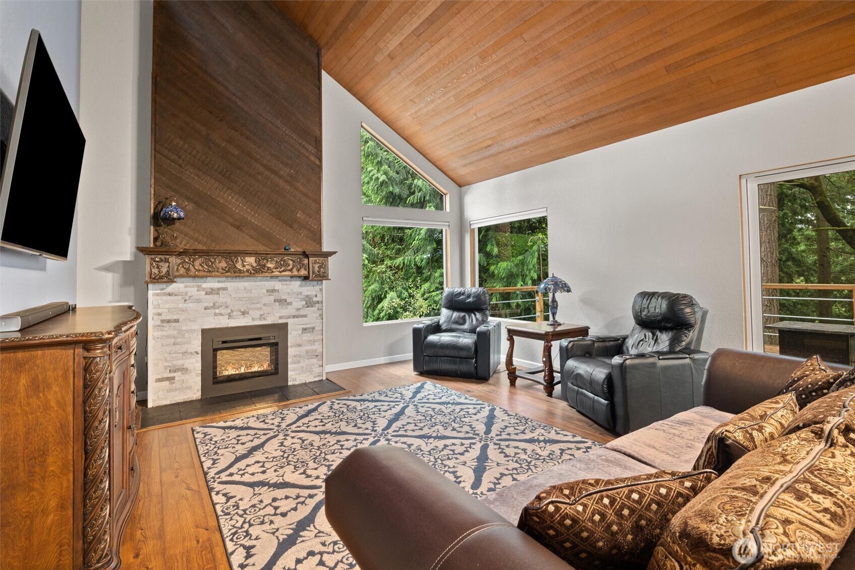 19833 95th Avenue Northeast Bothell, WA 98011 - Photo 8 of 39 a living room with furniture a fireplace and a flat screen tv