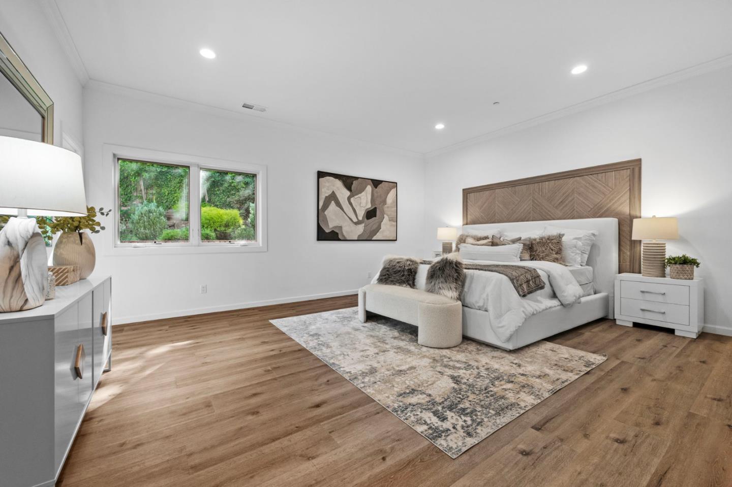 415 El Centro Road Hillsborough, CA 94010 - Photo 25 of 60 a spacious bedroom with a large bed and a window