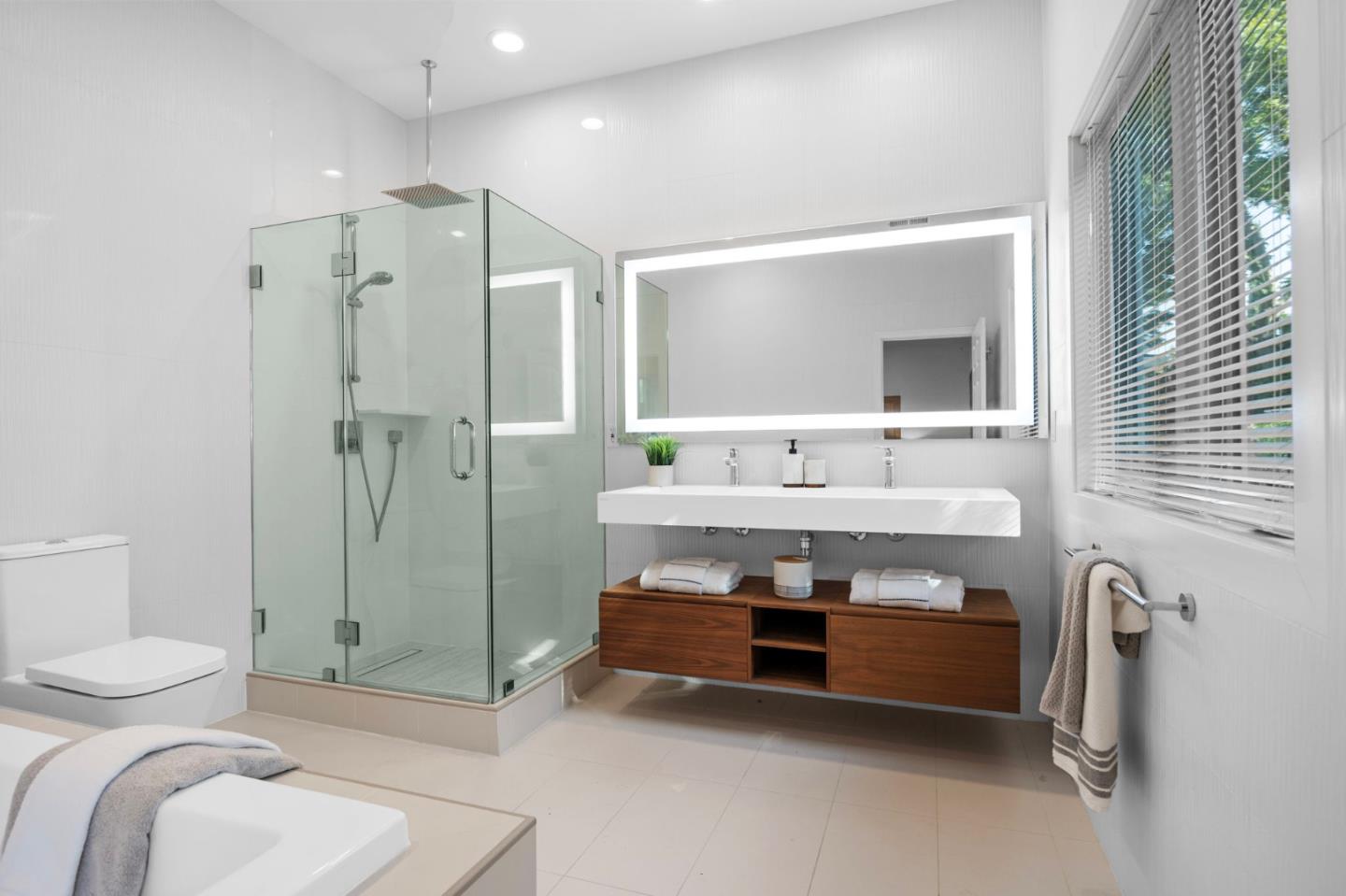 415 El Centro Road Hillsborough, CA 94010 - Photo 26 of 60 a bathroom with a sink a toilet and shower