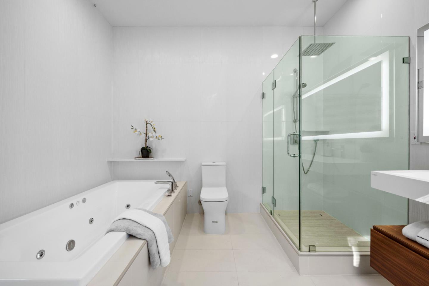 415 El Centro Road Hillsborough, CA 94010 - Photo 27 of 60 a bathroom with a bathtub and a shower