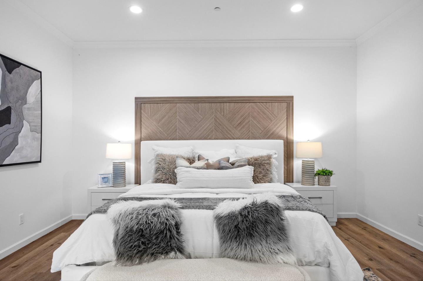 415 El Centro Road Hillsborough, CA 94010 - Photo 35 of 60 a bedroom with a bed and a painting on the wall