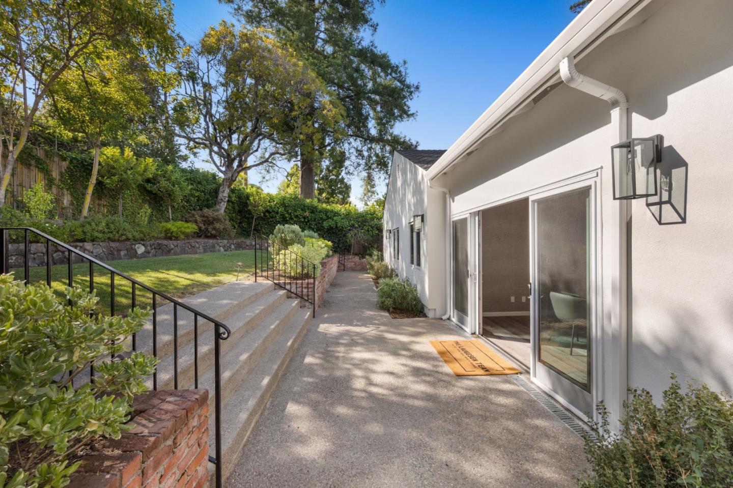415 El Centro Road Hillsborough, CA 94010 - Photo 49 of 60 a view of house with backyard and outdoor seating
