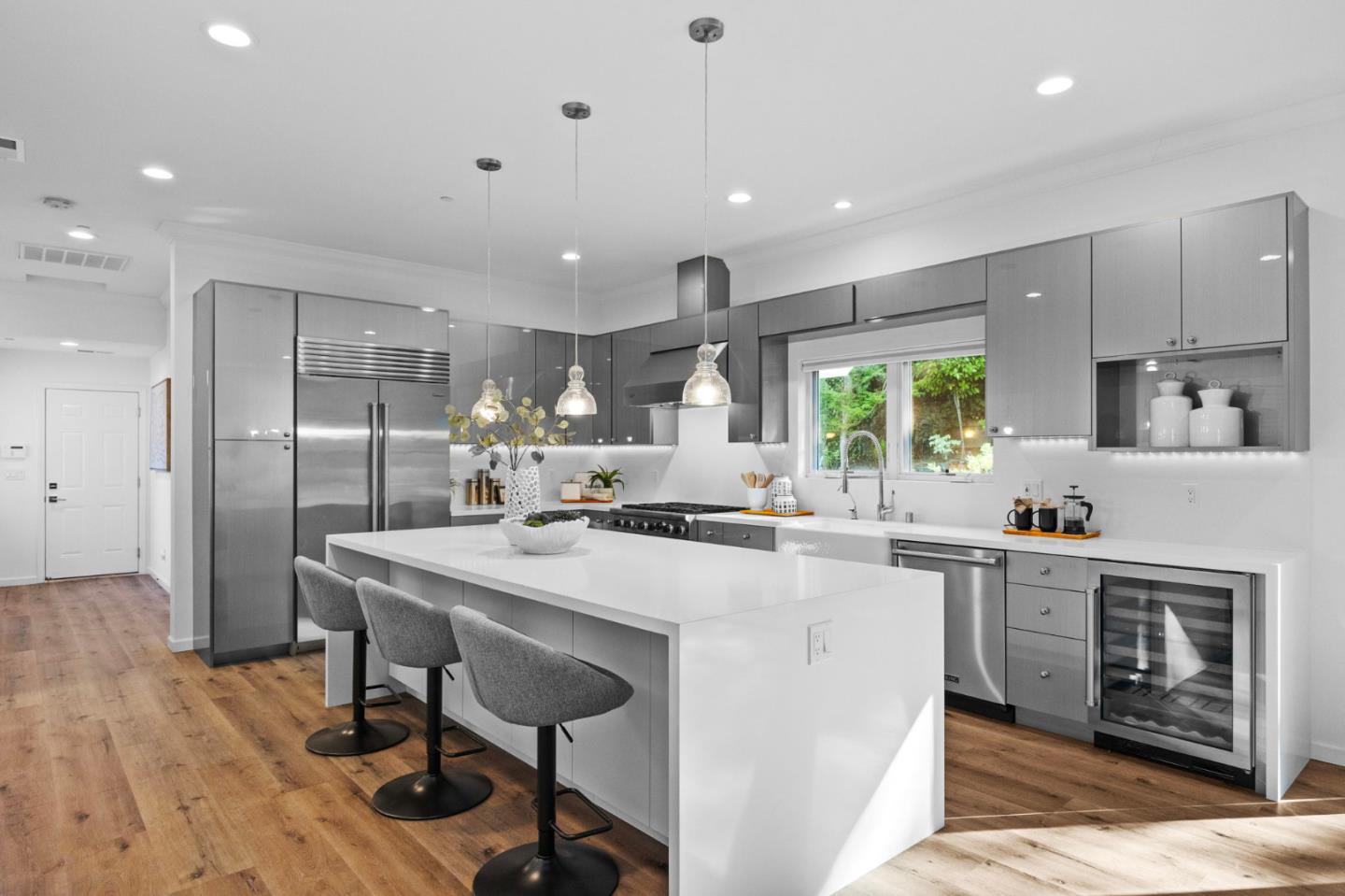 415 El Centro Road Hillsborough, CA 94010 - Photo 6 of 60 a kitchen with kitchen island a stove a table and chairs in it