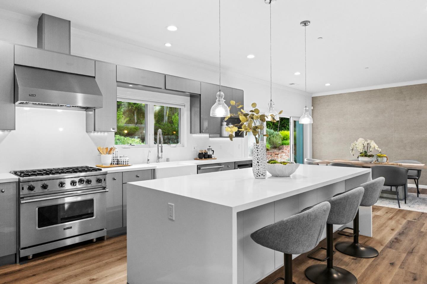 415 El Centro Road Hillsborough, CA 94010 - Photo 9 of 60 a kitchen with a stove a table and chairs