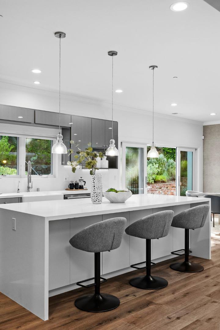 415 El Centro Road Hillsborough, CA 94010 - Photo 10 of 60 a kitchen with a sink a window and chairs