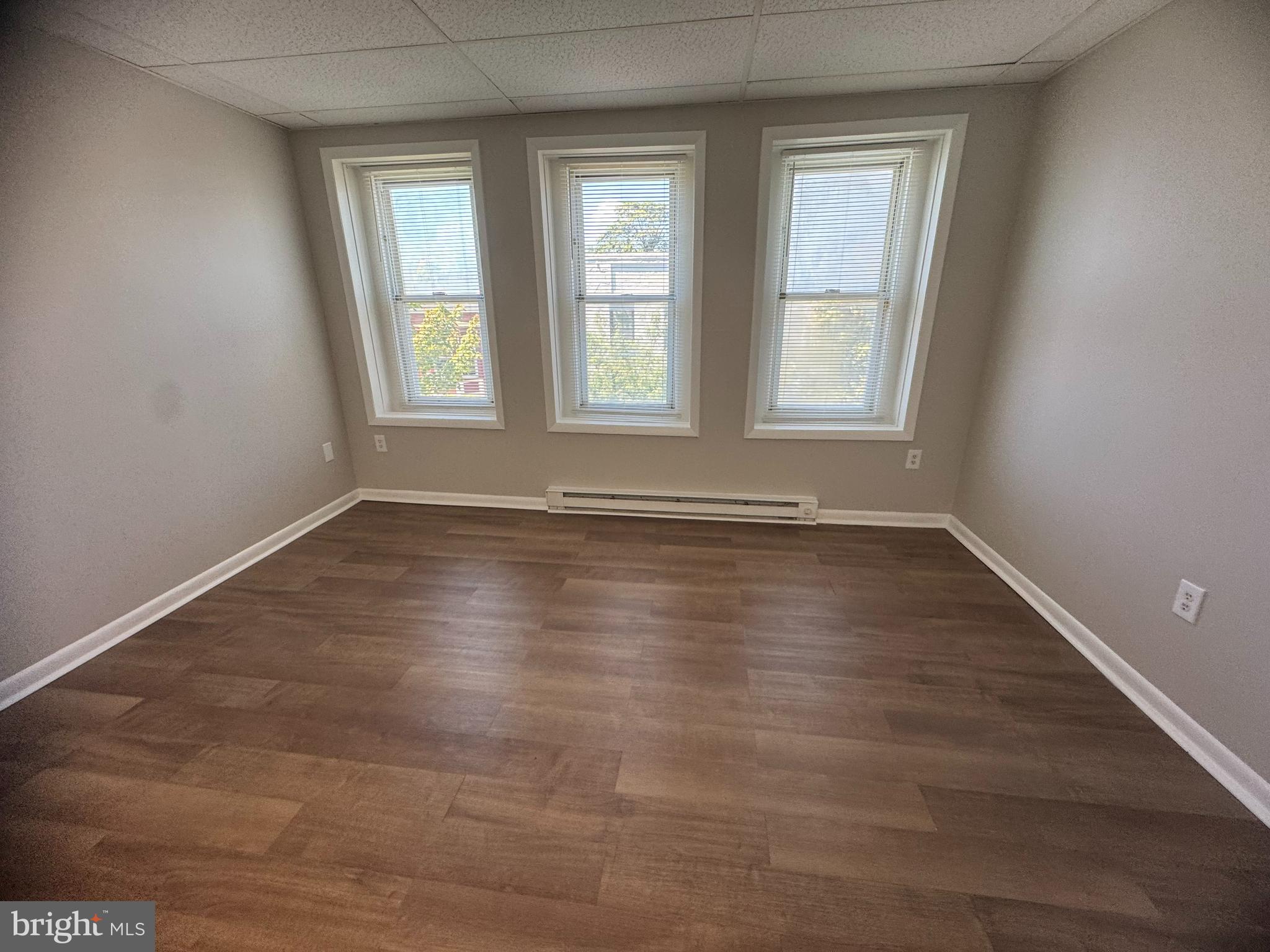 106 North Market Street, Unit 15 Frederick, MD 21701 - Photo 3 of 9 a view of room with window and hardwood floor