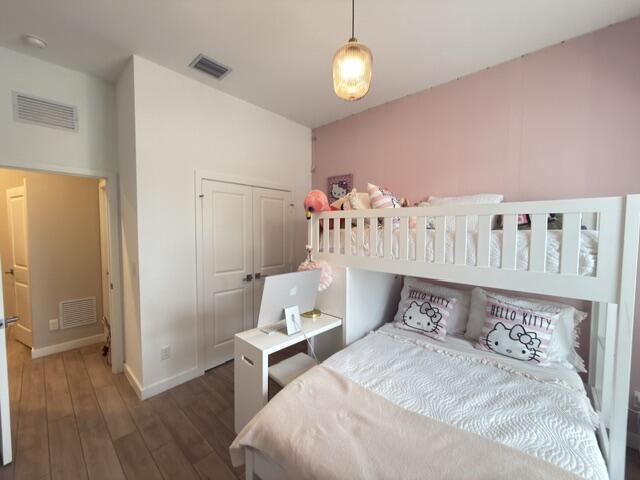 19696 Weathervane Way Loxahatchee, FL 33470 - Photo 23 of 39 a bedroom with bed and a table
