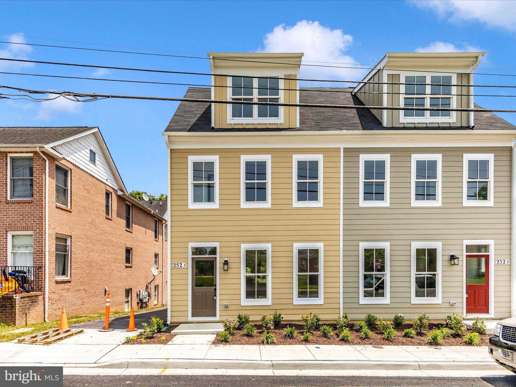 a front view of a building with a parking space