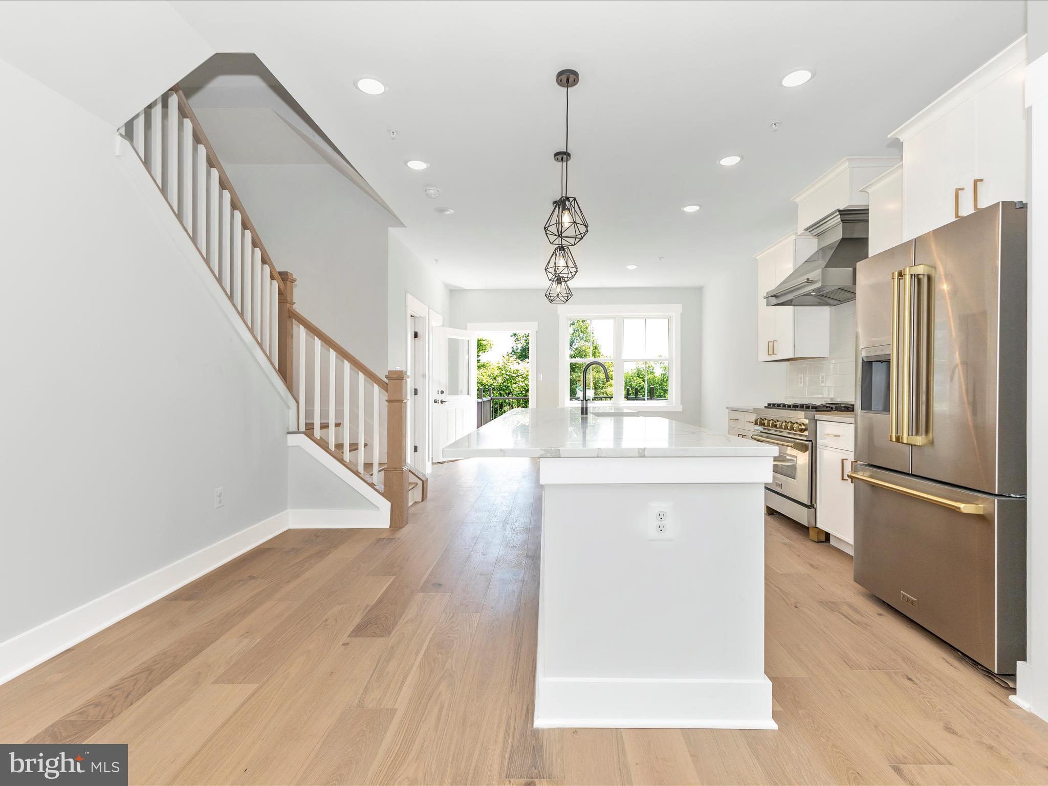 252 South Carroll Street Frederick, MD 21701 - Photo 11 of 68 a kitchen with stainless steel appliances granite countertop a refrigerator a stove a sink and a refrigerator