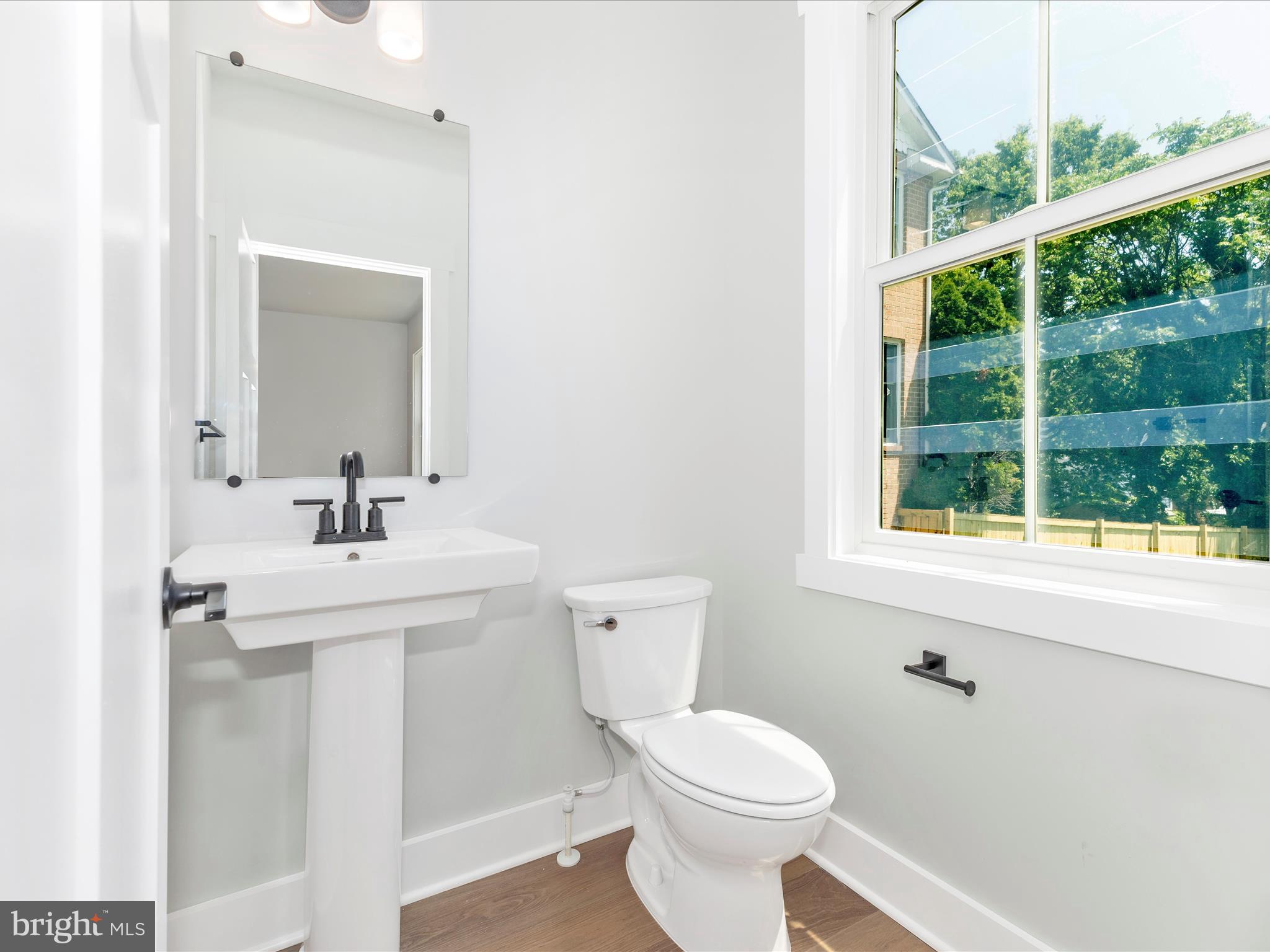 252 South Carroll Street Frederick, MD 21701 - Photo 20 of 68 a bathroom with a sink a toilet and a window