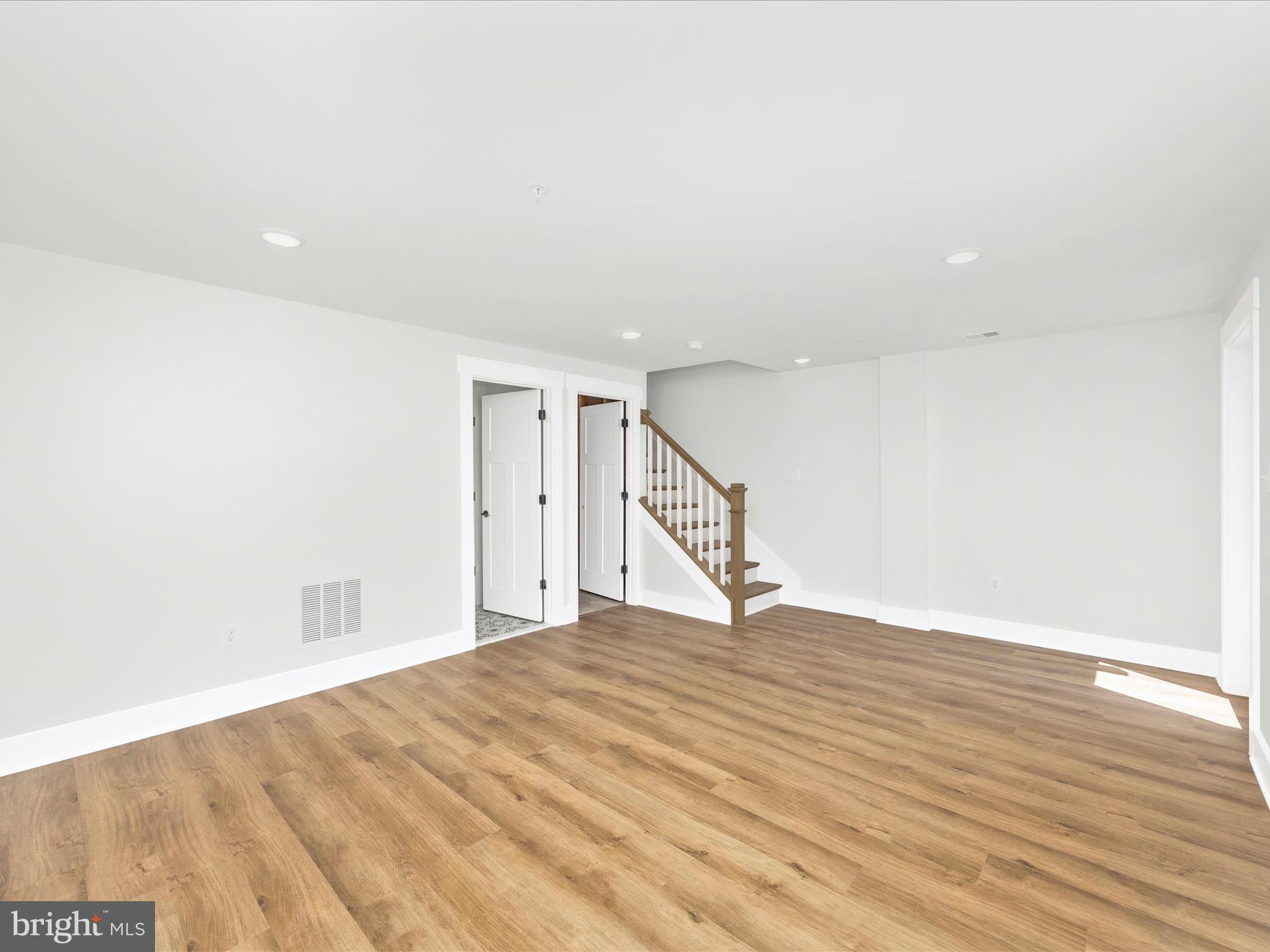 252 South Carroll Street Frederick, MD 21701 - Photo 24 of 68 a view of an empty room with wooden floor