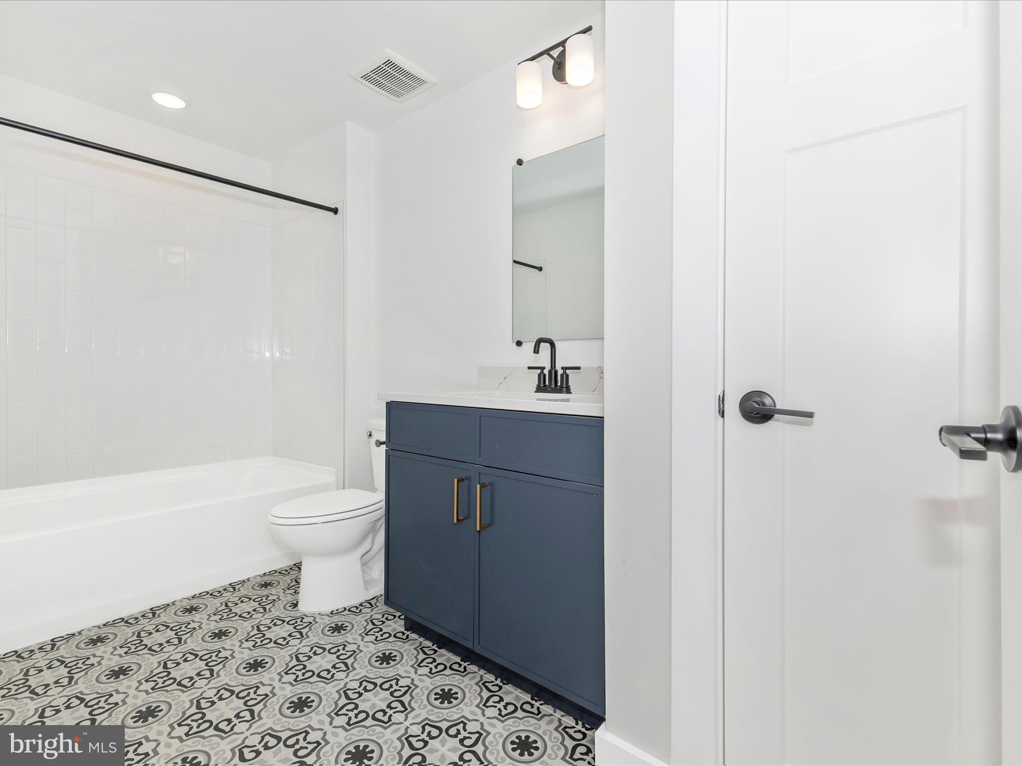 252 South Carroll Street Frederick, MD 21701 - Photo 25 of 68 a bathroom with a sink toilet and shower