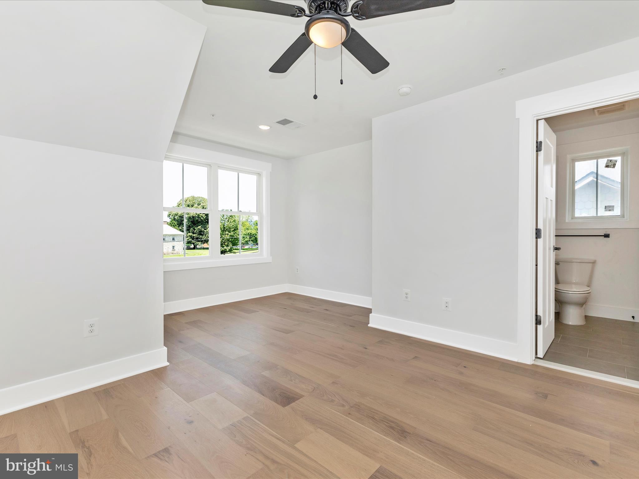 252 South Carroll Street Frederick, MD 21701 - Photo 29 of 68 wooden floor in an empty room with a window