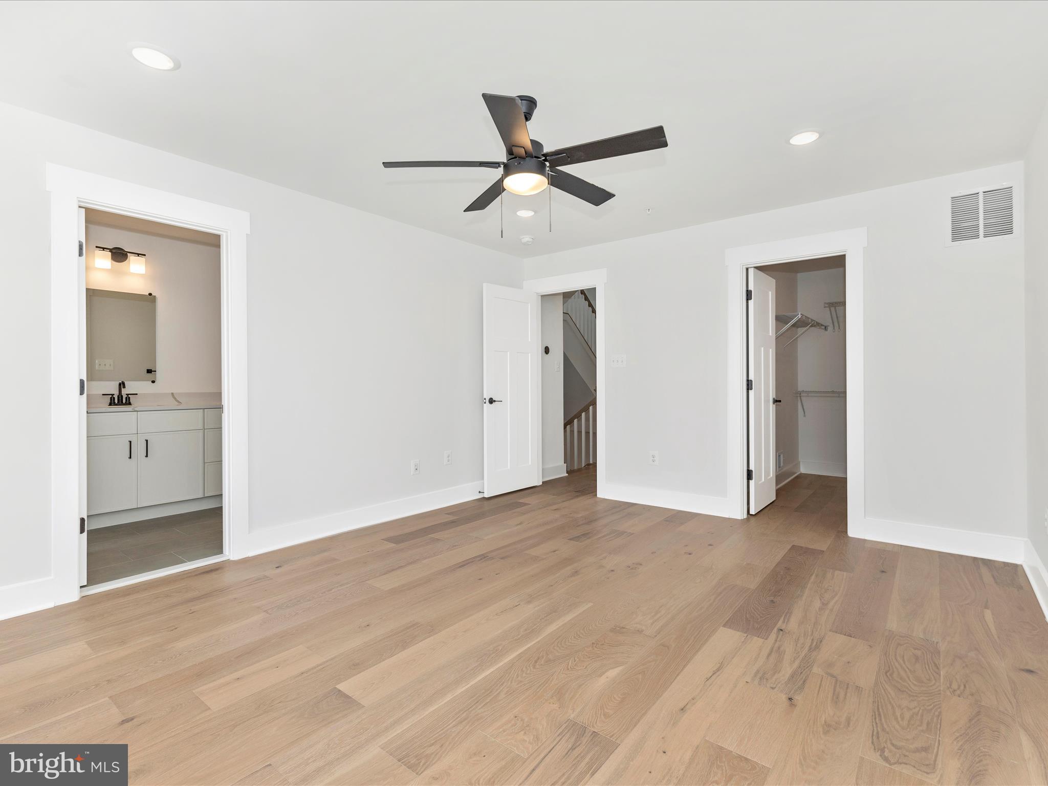 252 South Carroll Street Frederick, MD 21701 - Photo 42 of 68 a view of empty room with wooden floor and ceiling fan