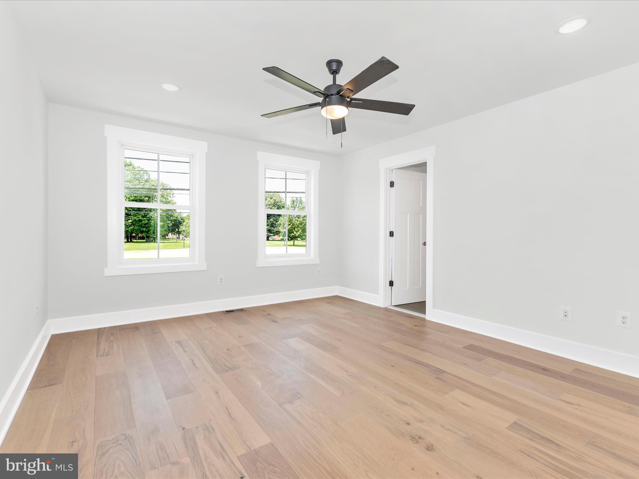252 South Carroll Street Frederick, MD 21701 - Photo 43 of 68 a view of a big room with wooden floor and windows