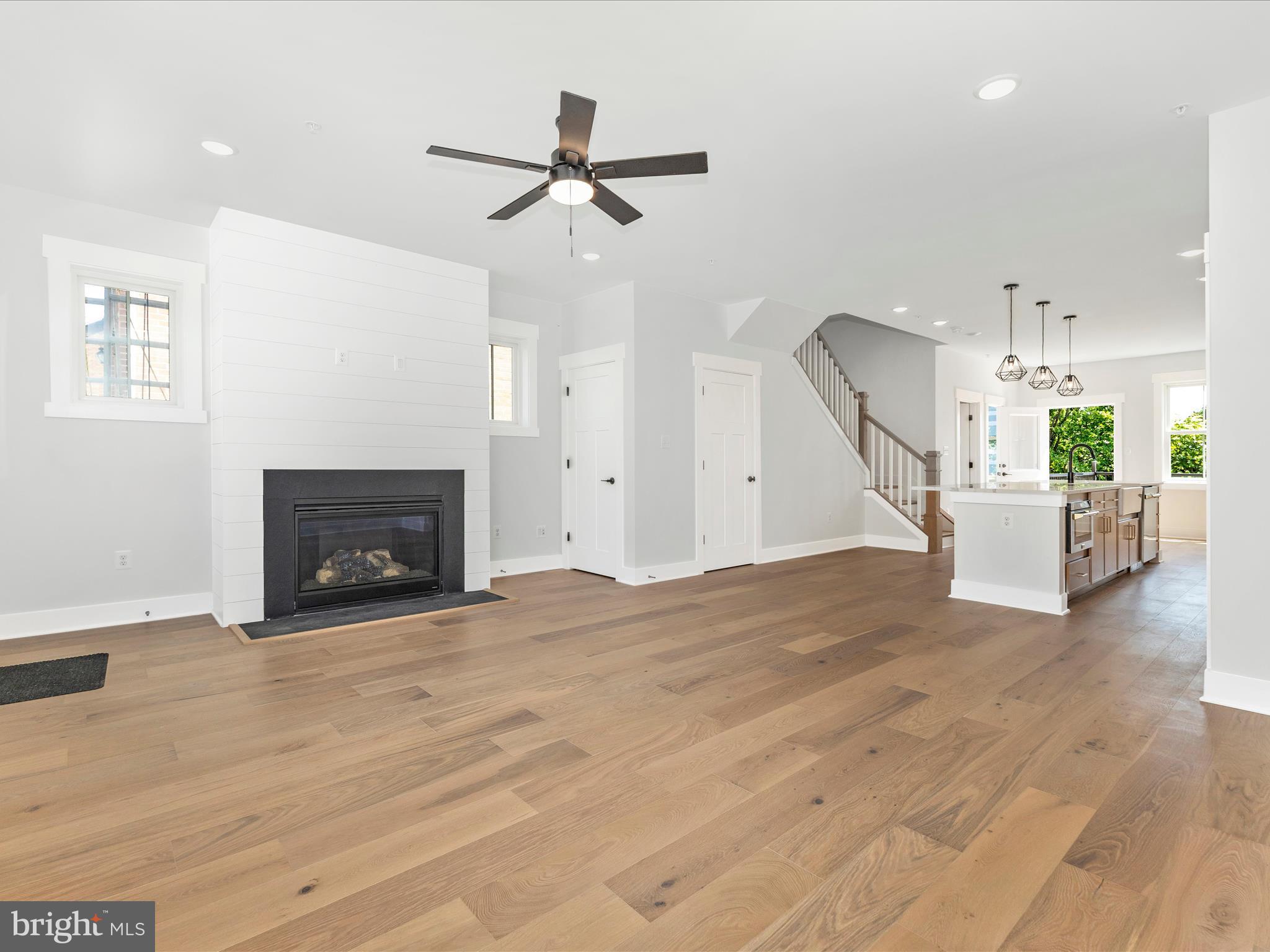 252 South Carroll Street Frederick, MD 21701 - Photo 5 of 68 a view of a livingroom with a fireplace and ceiling fan