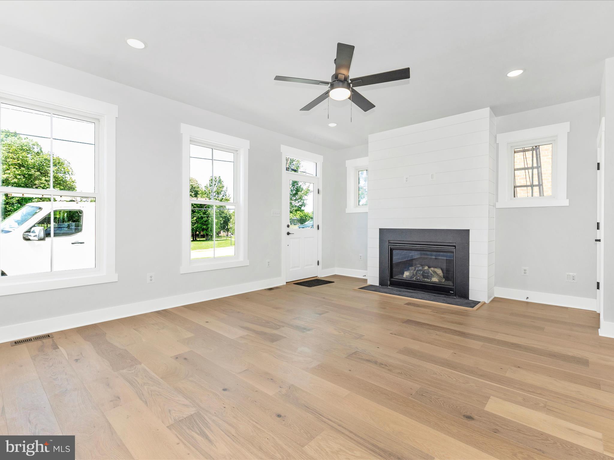 252 South Carroll Street Frederick, MD 21701 - Photo 8 of 68 a view of an empty room with a window and fireplace
