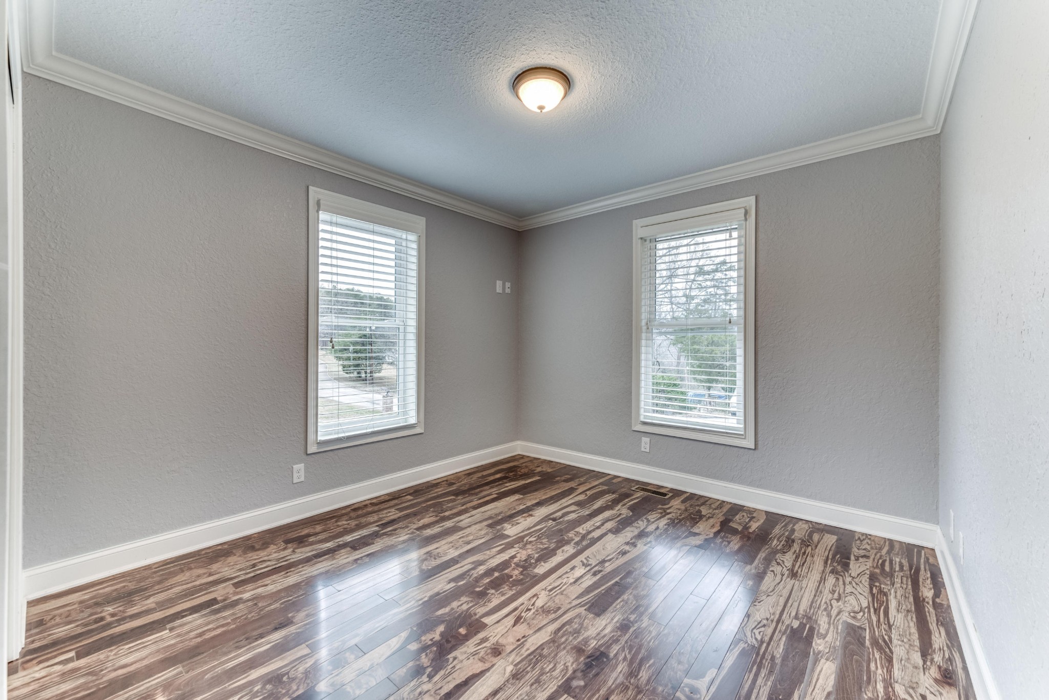 3405 Shagbark Road Powell, TN 37849 - Photo 11 of 20 a view of an empty room with wooden floor and a window