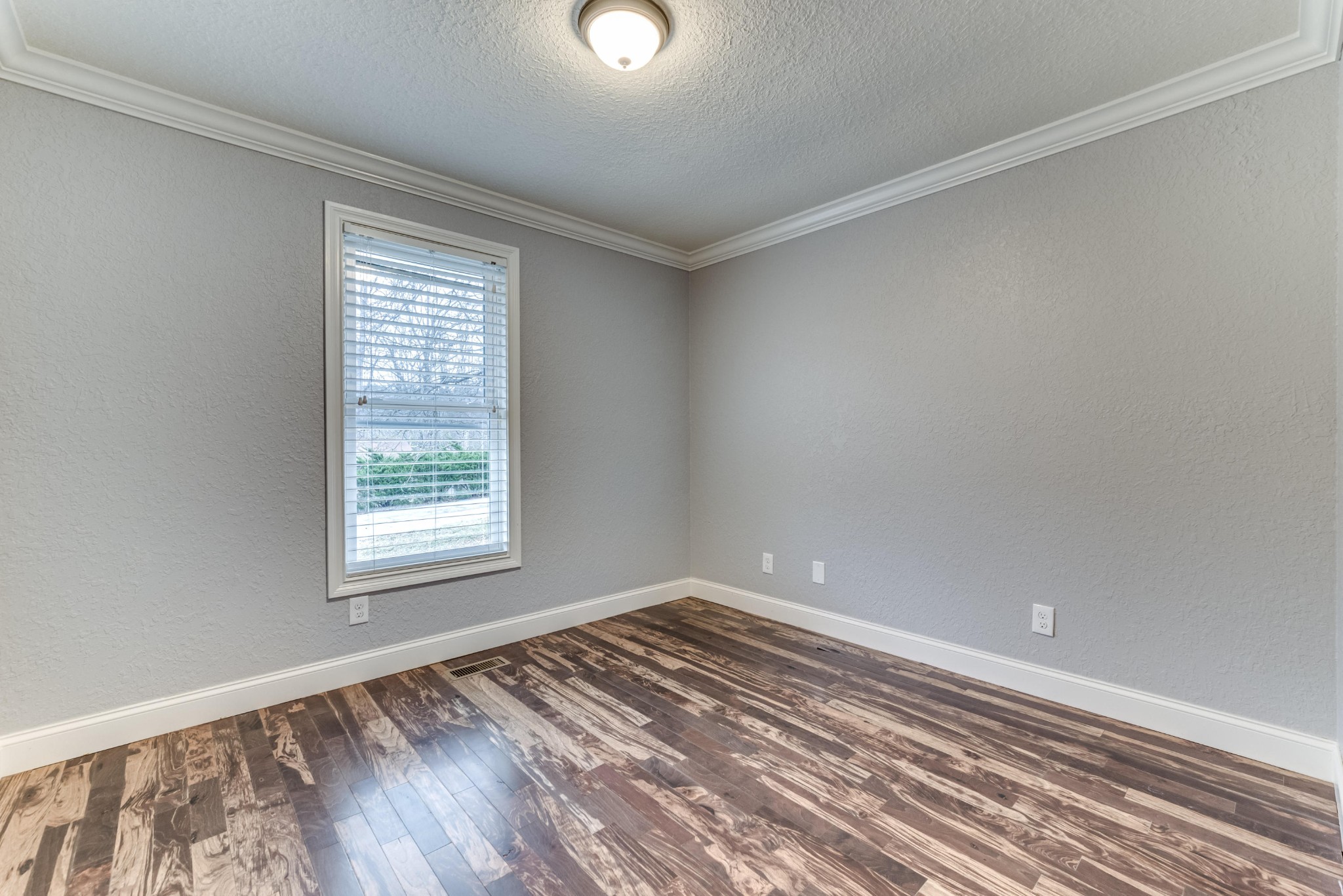 3405 Shagbark Road Powell, TN 37849 - Photo 13 of 20 a view of an empty room with wooden floor and a window
