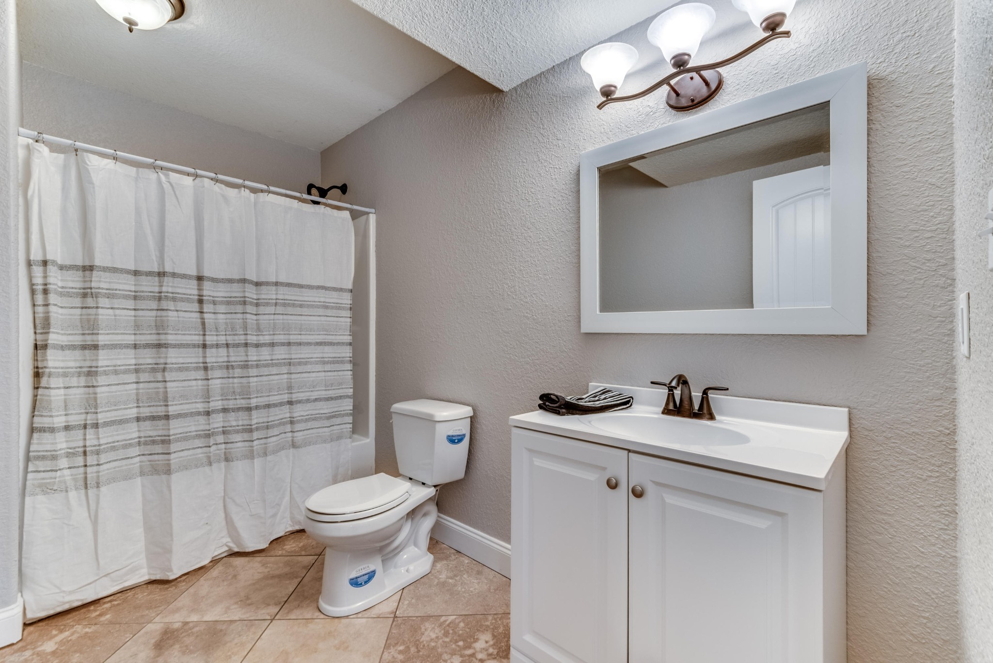 3405 Shagbark Road Powell, TN 37849 - Photo 16 of 20 a bathroom with a toilet sink and mirror