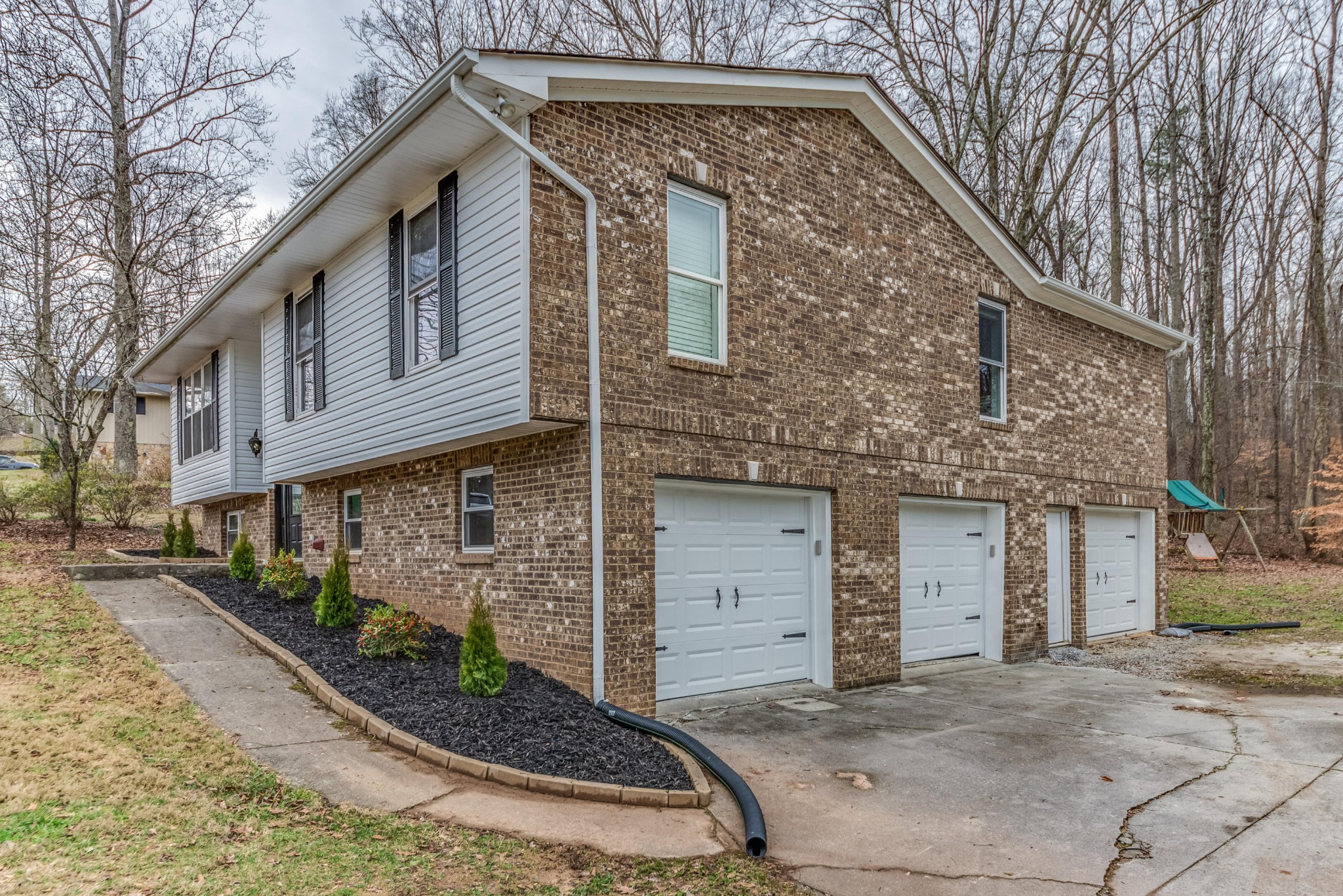 3405 Shagbark Road Powell, TN 37849 - Photo 17 of 20 a front view of a house with garage