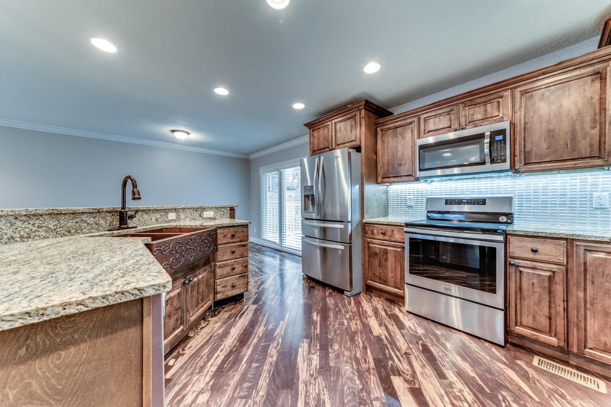3405 Shagbark Road Powell, TN 37849 - Photo 5 of 20 a kitchen with stainless steel appliances kitchen island granite countertop a stove and a sink