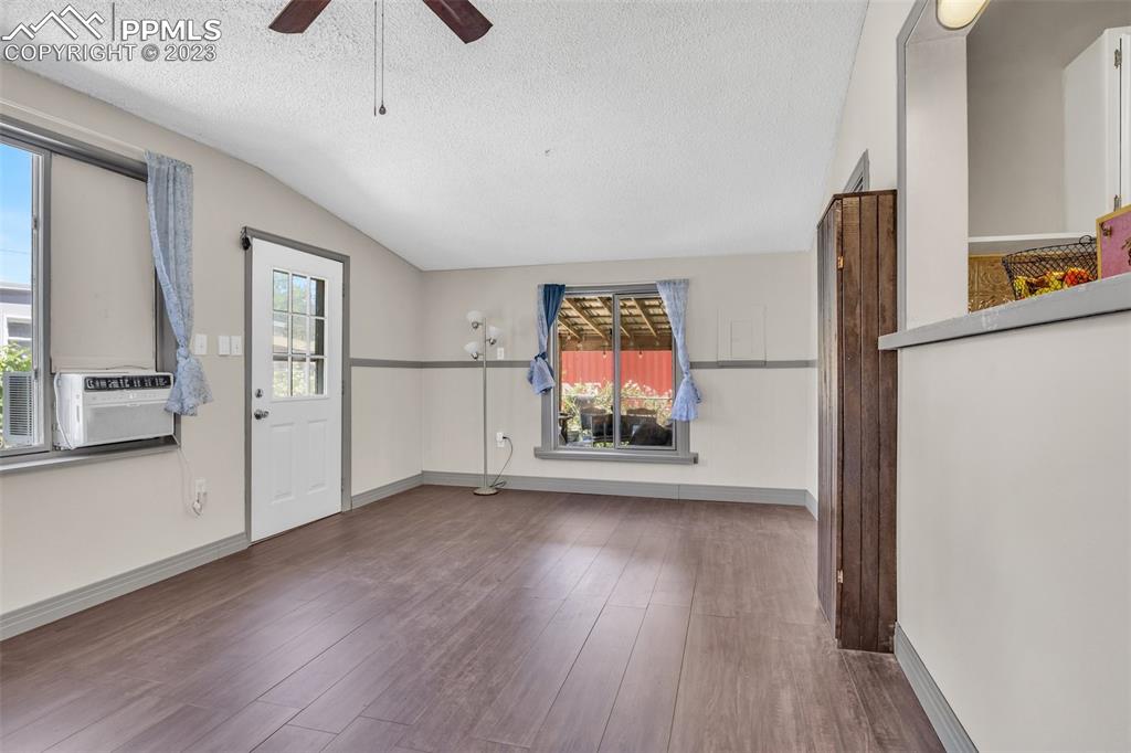 1330 West 3rd Street Florence, CO 81226 - Photo 11 of 34 wooden floor in an empty room with a window