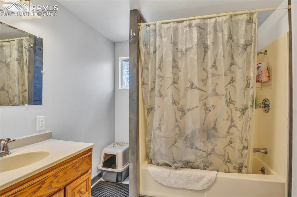 1330 West 3rd Street Florence, CO 81226 - Photo 13 of 34 a bathroom with a sink and a mirror