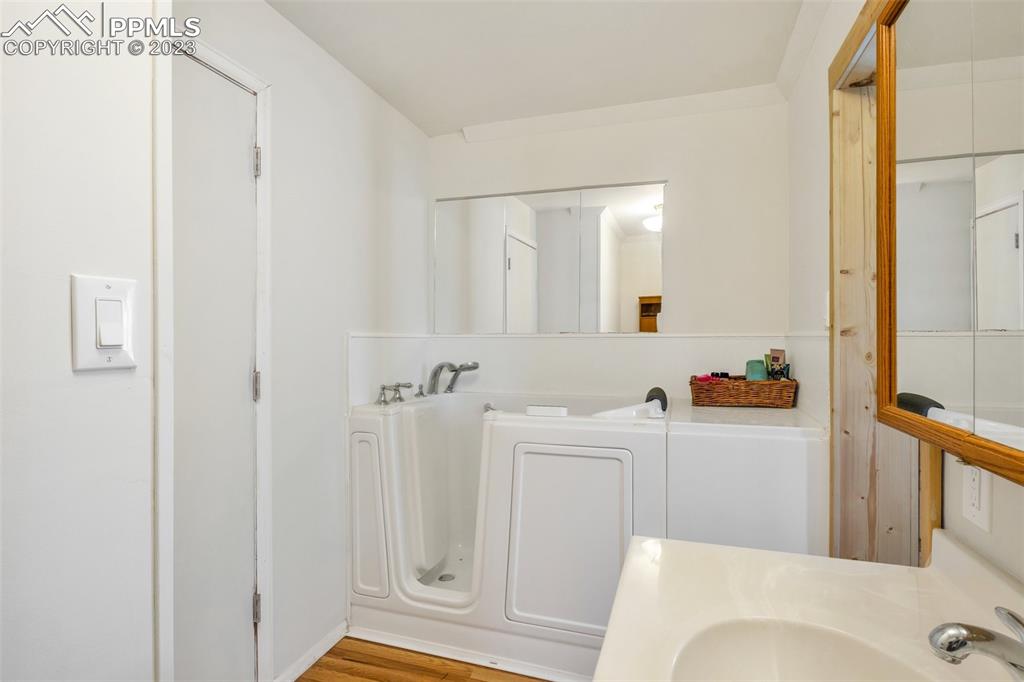 1330 West 3rd Street Florence, CO 81226 - Photo 16 of 34 a bathroom with a sink a toilet and shower