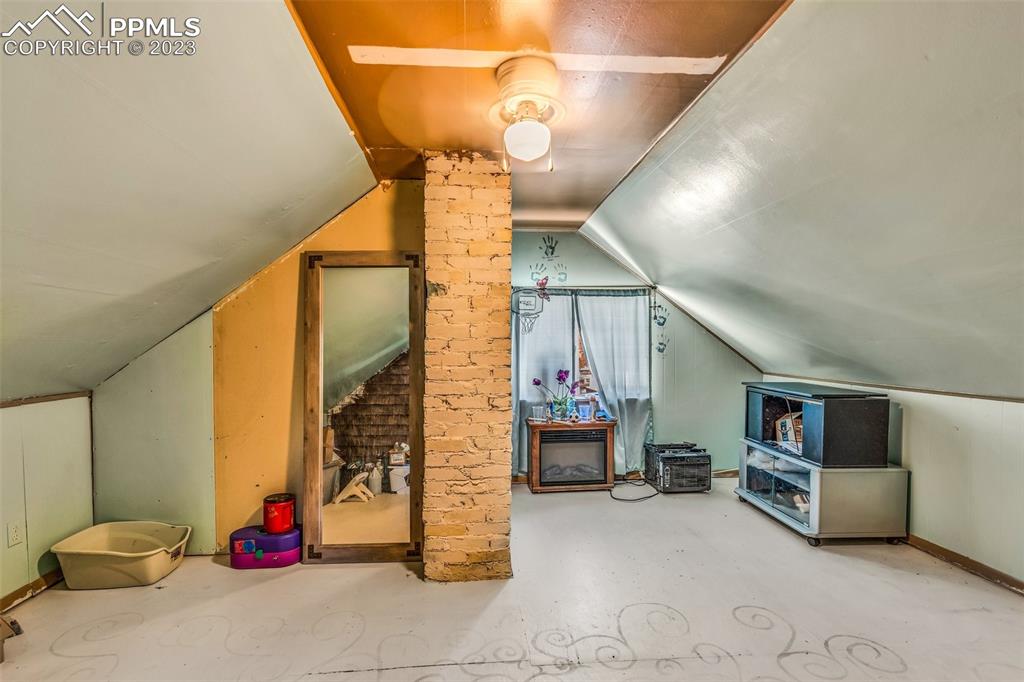 1330 West 3rd Street Florence, CO 81226 - Photo 21 of 34 a view of game room with window and couch