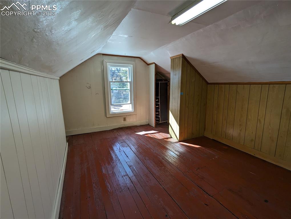 1330 West 3rd Street Florence, CO 81226 - Photo 24 of 34 an empty room with wooden floor and windows