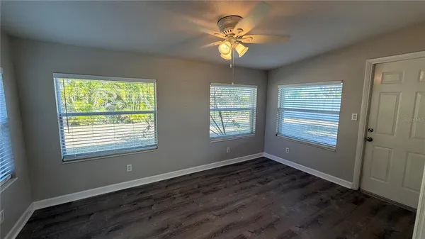 a view of an empty room with a window