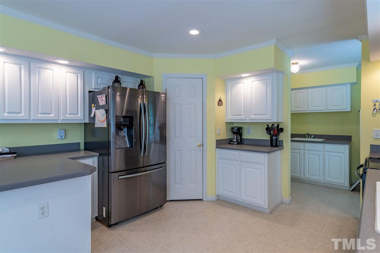 9563 Whippoorwill Ridge Road Bullock, NC 27507 - Photo 7 of 30 And notice the Butlers Pantry area just beyond the Kitchen...