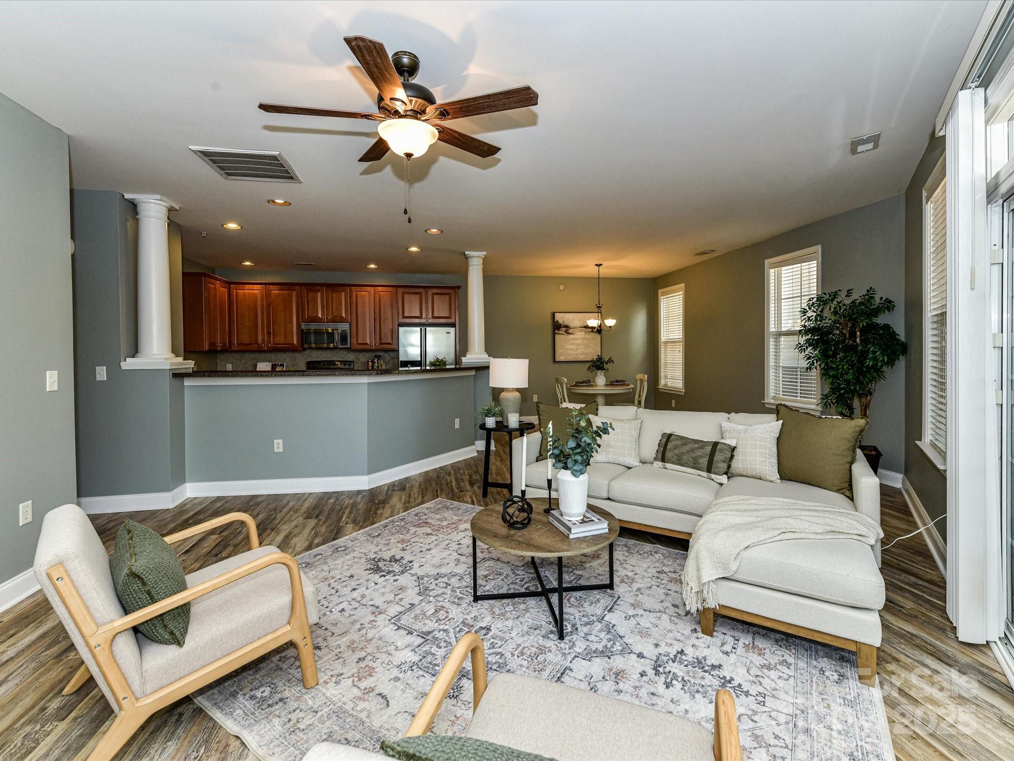 9065 Rosalyn Glen Road Cornelius, NC 28031 - Photo 14 of 35 a living room with furniture and kitchen view