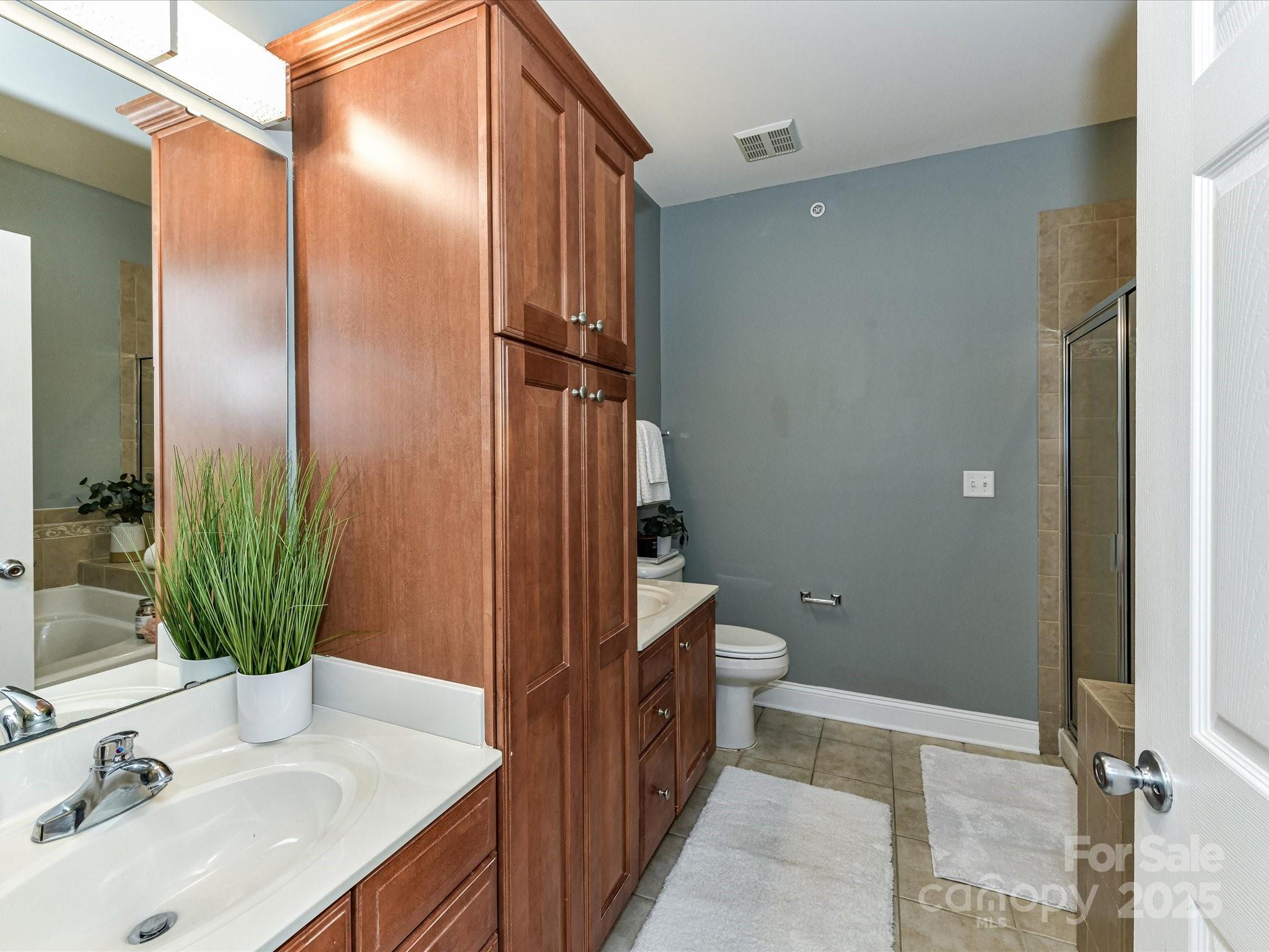 9065 Rosalyn Glen Road Cornelius, NC 28031 - Photo 17 of 35 a bathroom with a sink and a mirror