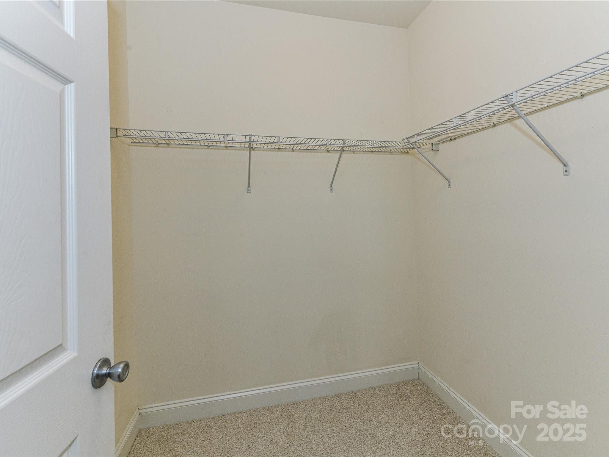 9065 Rosalyn Glen Road Cornelius, NC 28031 - Photo 19 of 35 a view of an empty walk in closet