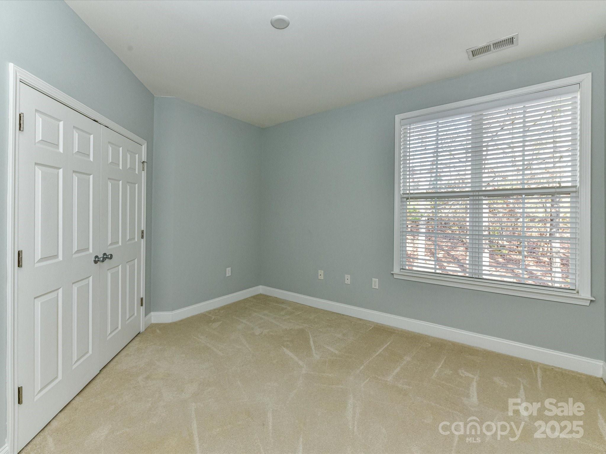 9065 Rosalyn Glen Road Cornelius, NC 28031 - Photo 20 of 35 a view of an empty room with a window