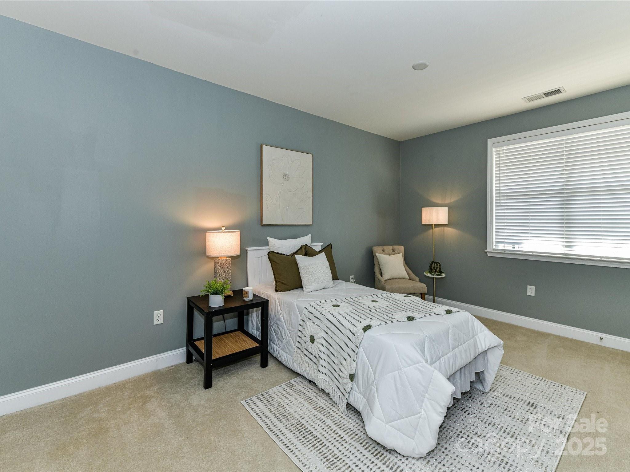 9065 Rosalyn Glen Road Cornelius, NC 28031 - Photo 23 of 35 a room with a bed and a window