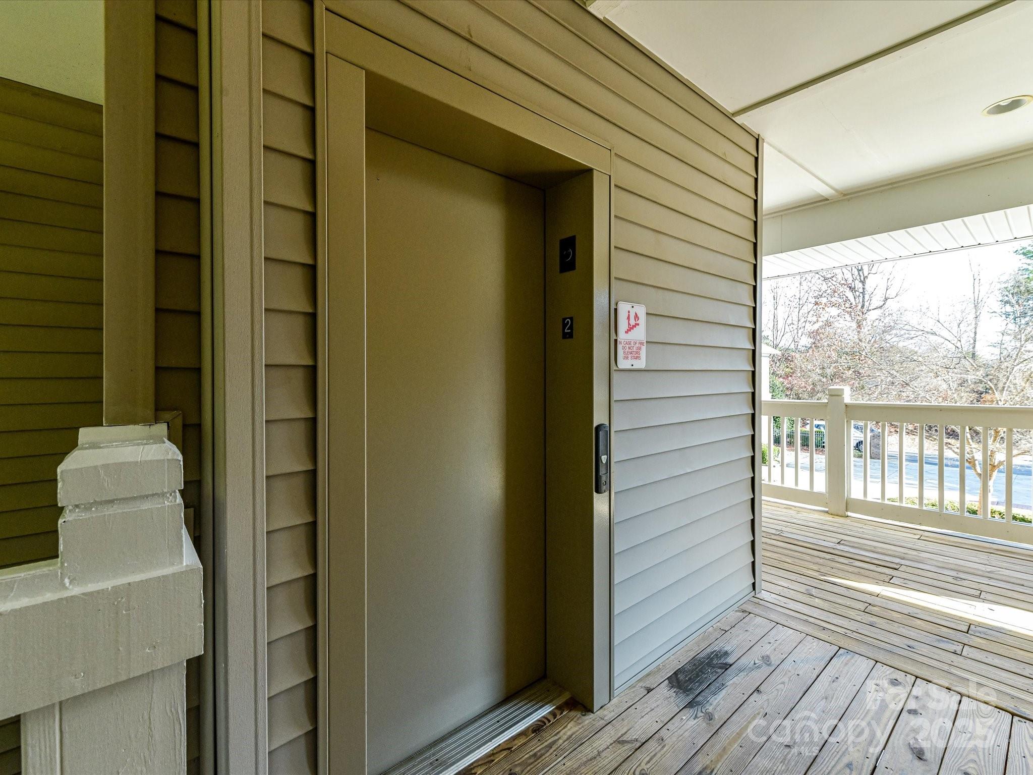 9065 Rosalyn Glen Road Cornelius, NC 28031 - Photo 28 of 35 a view of a balcony with wooden floor